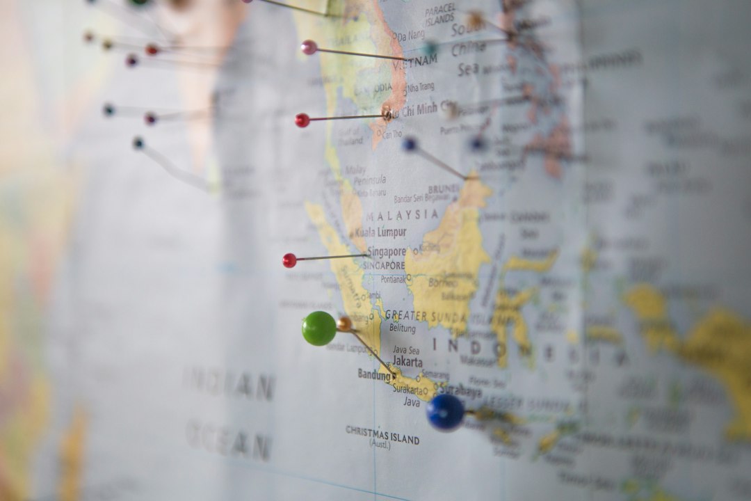 World map with travel pins for comparing destinations