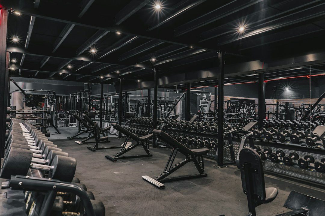 A gym filled with machines and weights, matching the fitness day-pass guide
